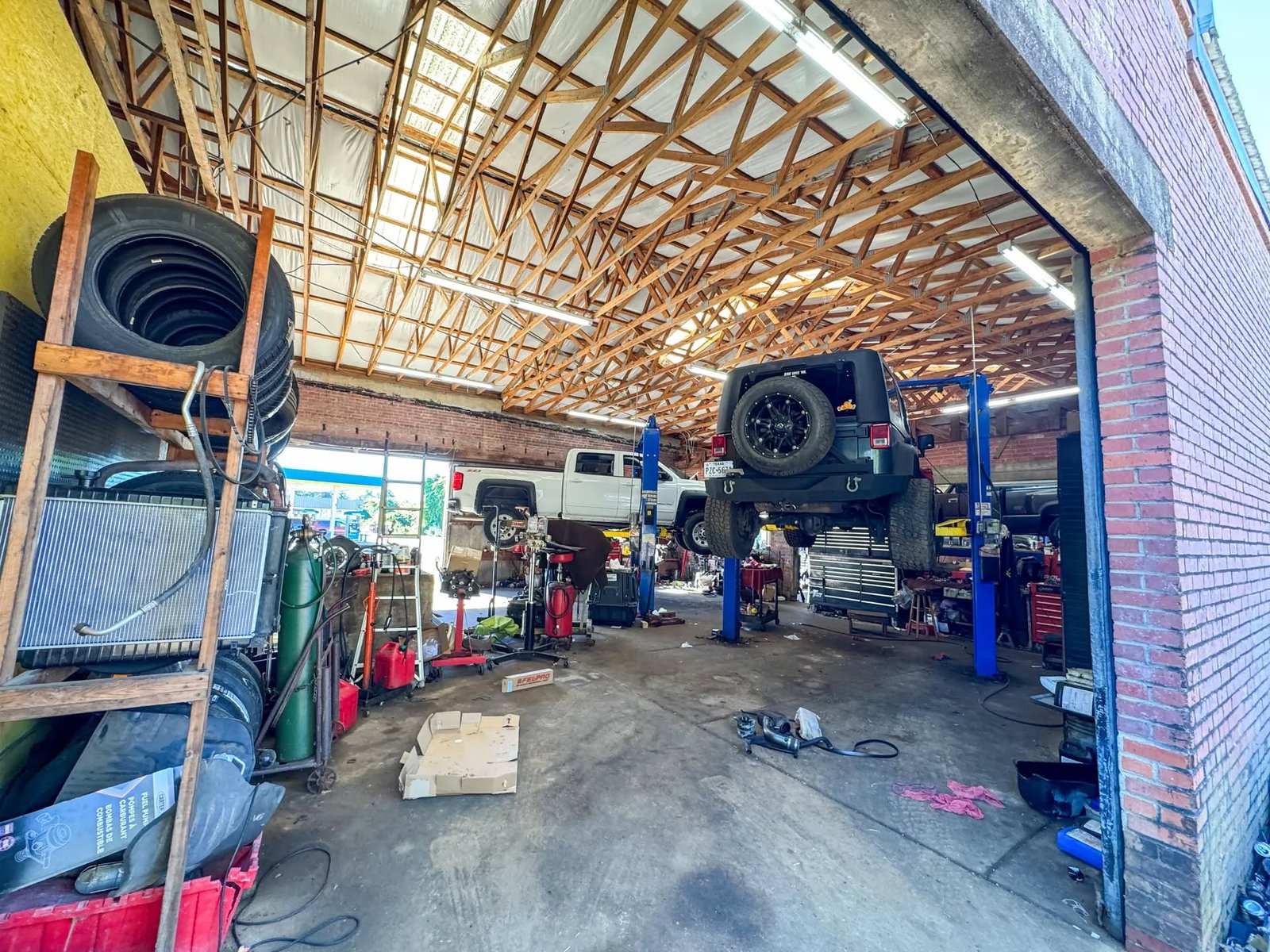 B & G Automotive service bay with lifts and equipment